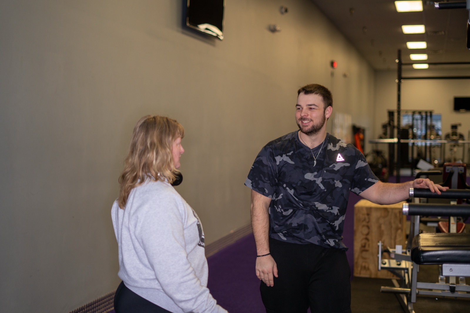 Eli coaching a member one-on-one